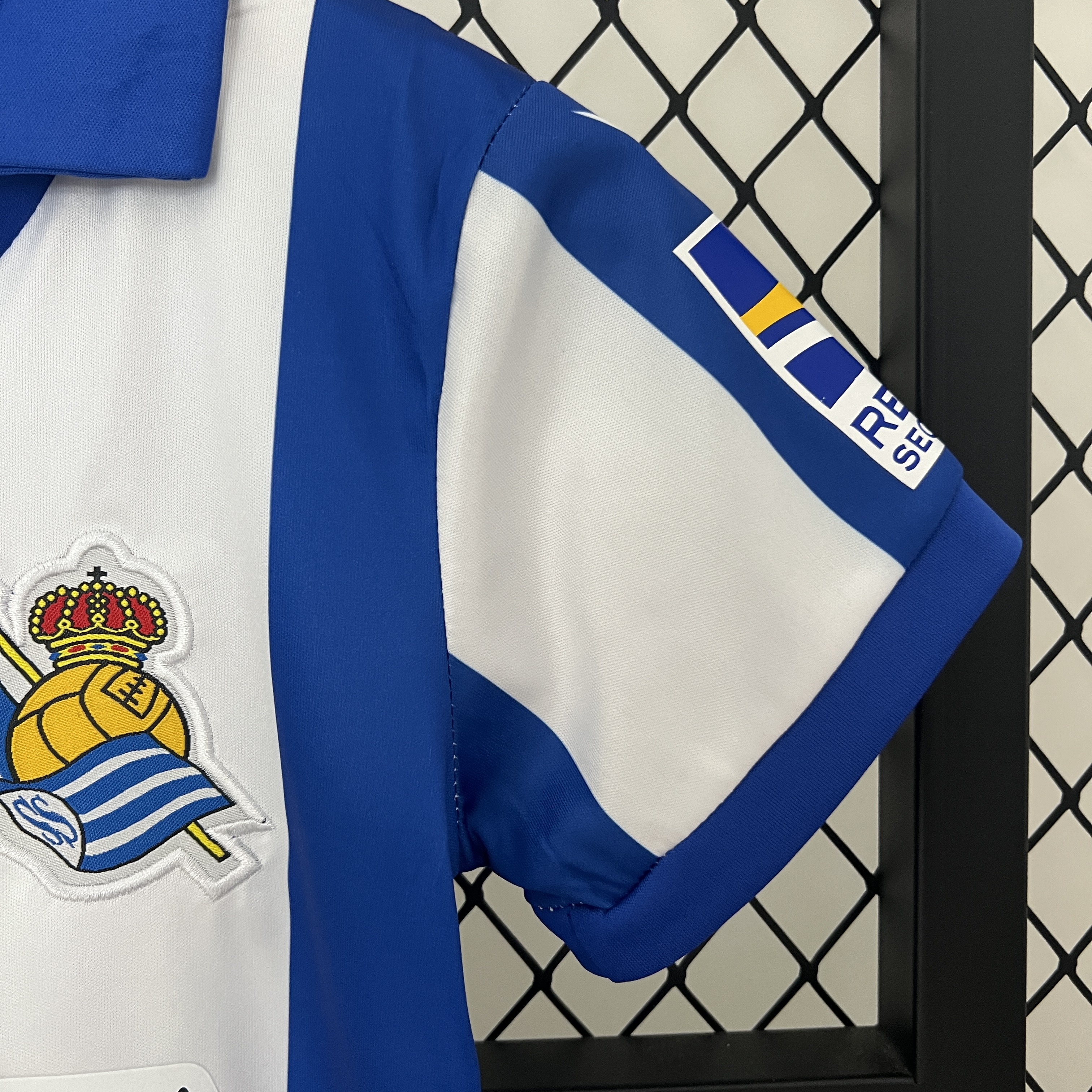 ManixJersey.com | Real Sociedad 24-25 Home Stadium Kids Kit -Customize Name, Number and Patch | Worldwide Shipping