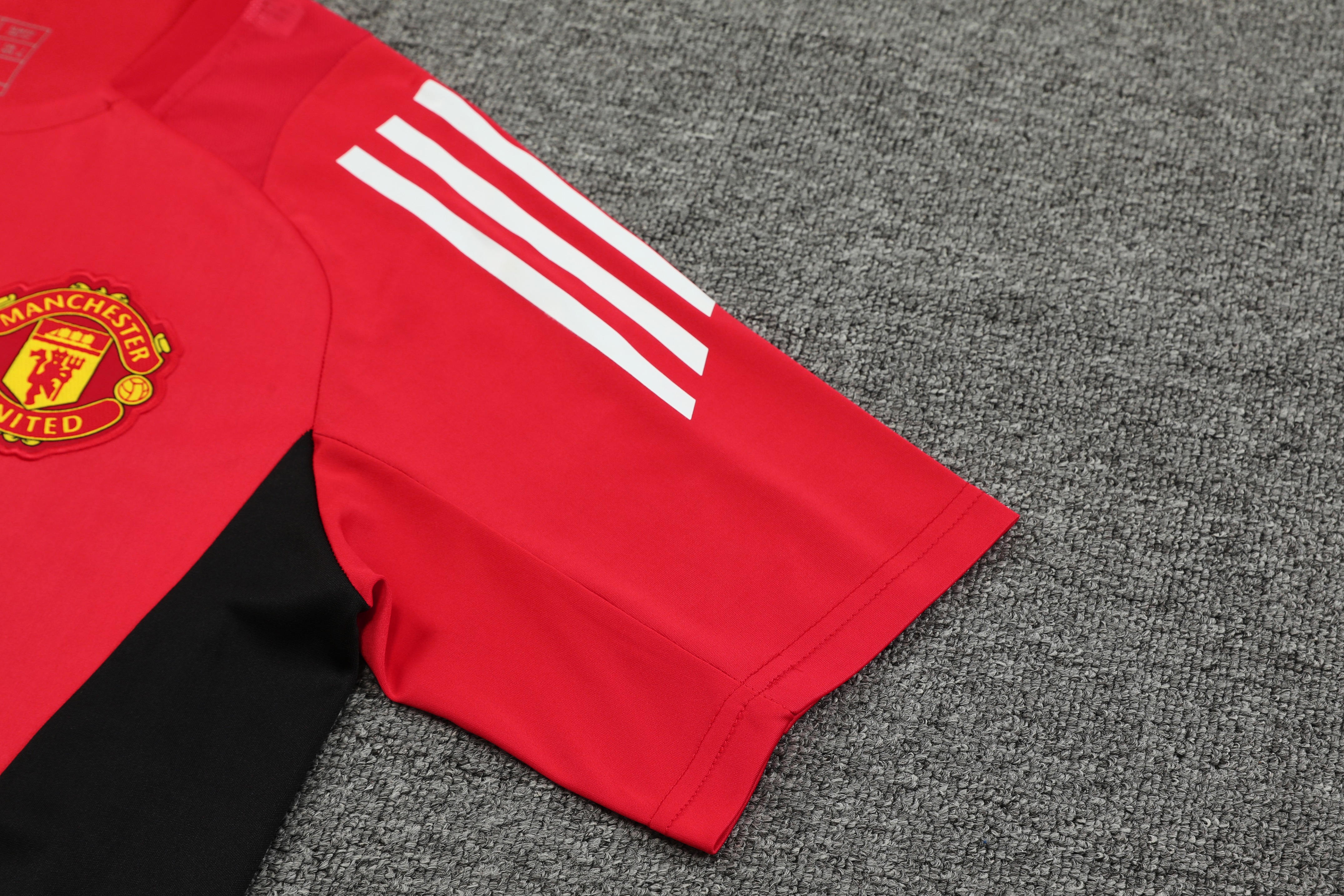ManixJersey.com | Manchester United 24-25 Short-Sleeve Training Kids Kit - Red Top and Black Shorts -Customize Name, Number and Patch | Worldwide Shipping