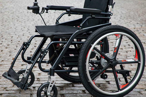Model H Hybrid Chair showcasing dual mobility modes with a sleek, black design.