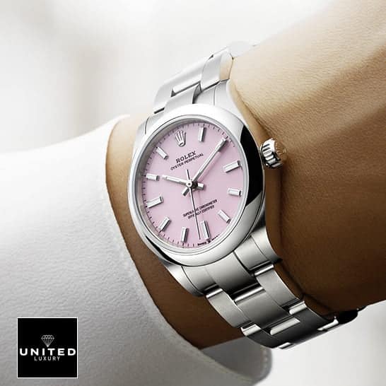 Rolex Oyster Perpetual 124300 Pink Dial Oyster Replica on his arm