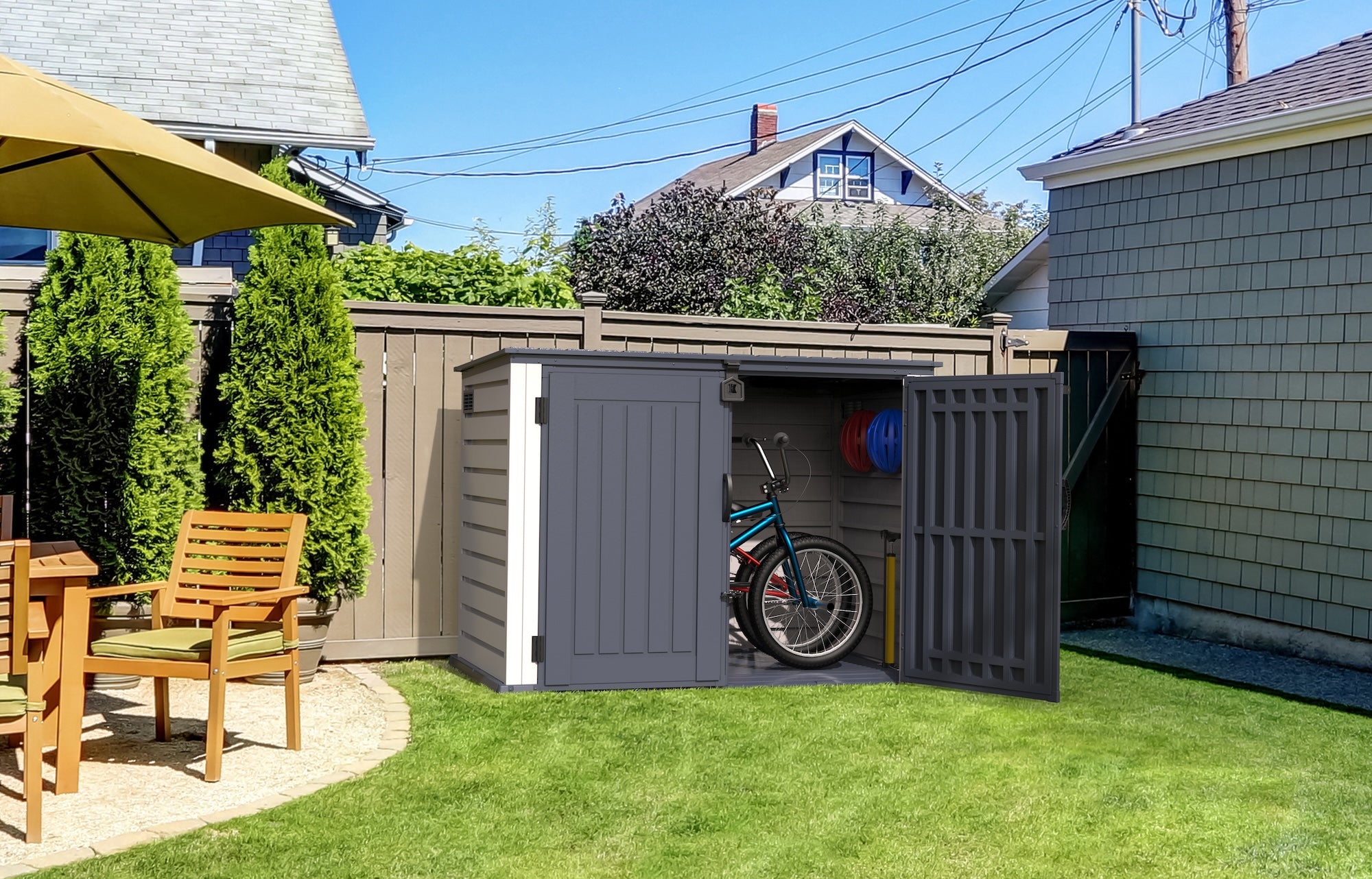 Duramax 2100L MultiStore outdoor storage shed with bike and sports equipment, ideal for backyard organization and weatherproof storage.