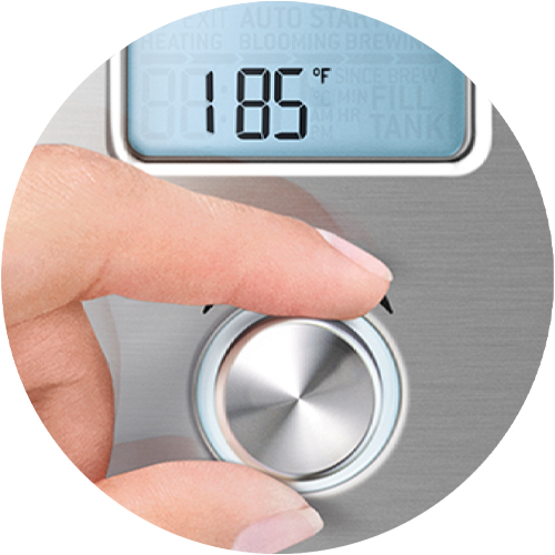A hand controlling the brewing temperature on the product display.