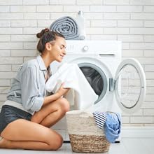 Woman smelling her frangrence free clean clothes