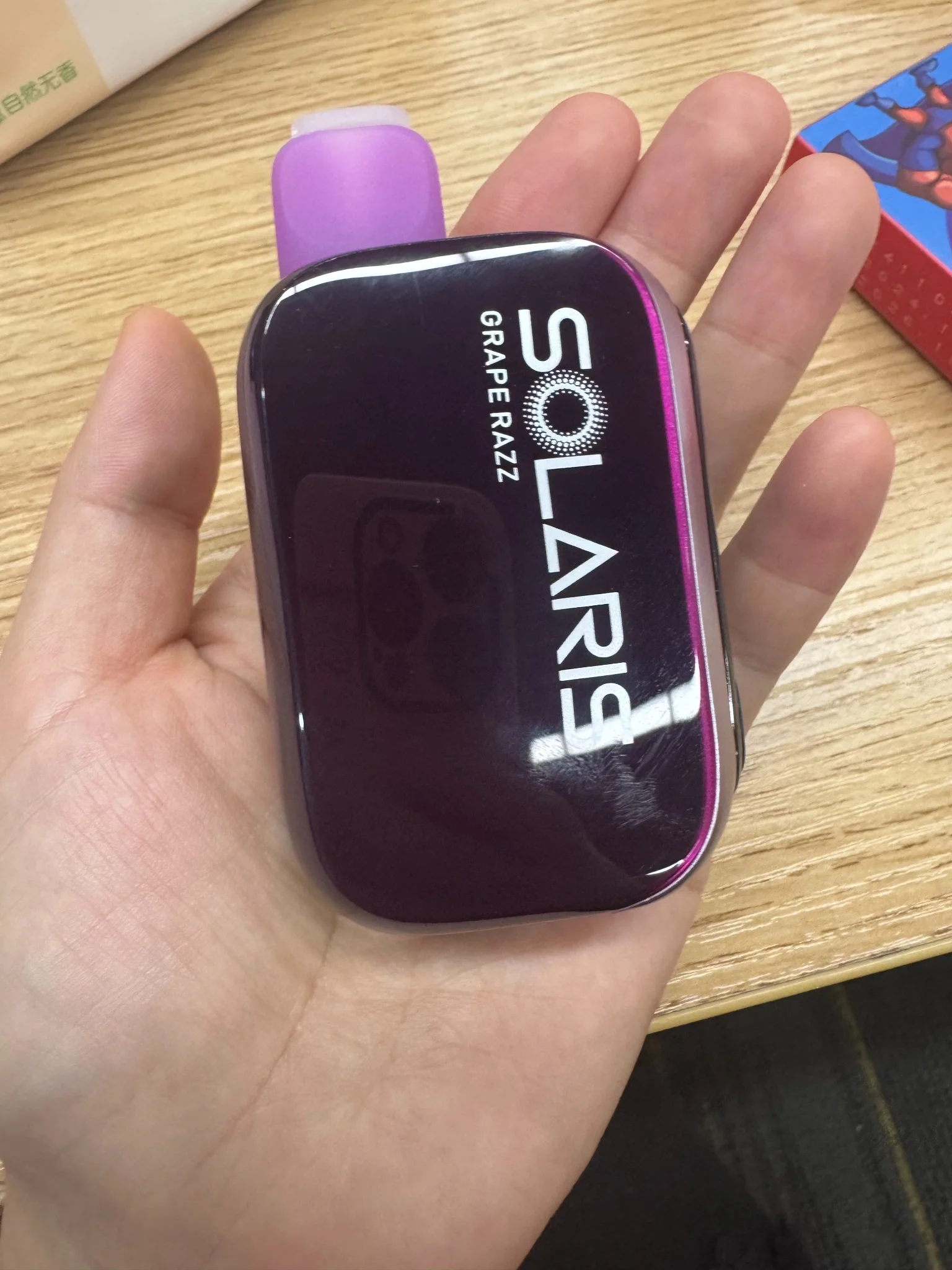 Solaris 25K Grape Razz - Real Photo Real-life photo of Solaris 25K Grape Razz vape held in hand