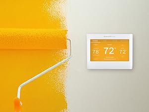 Wi-Fi Thermostat on wall next to paint roller