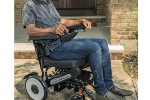 Move Lite Folding Power Wheelchair showing robust flat-free tires ideal for safe and reliable outdoor performance.