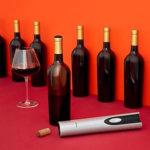 Wine Opener and Wine Bottles on Orange Background