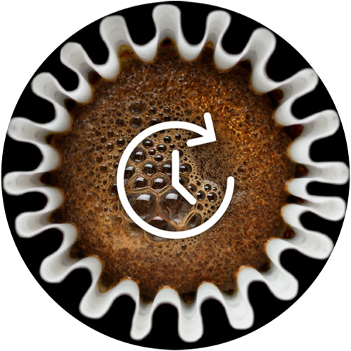 Coffee brewing in a filter basket with a clock icon on top of it.