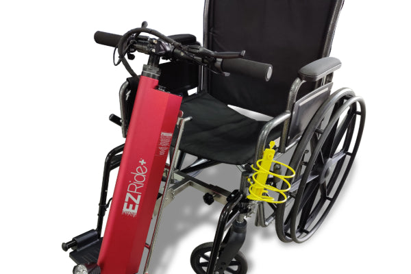 EZ Ride Wheelchair Power Assist Attachment, featuring a sleek design with a red motor unit and ergonomic handle, designed to enhance mobility for wheelchair users.