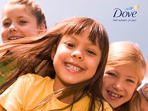 Portrait of three smiling young girls against a light blue background featuring a Dove logo.