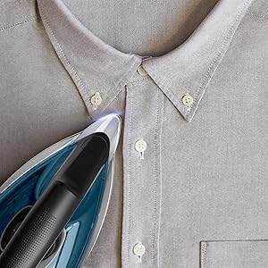 rowenta iron precision tip ironing a linen shirt with steam station iron