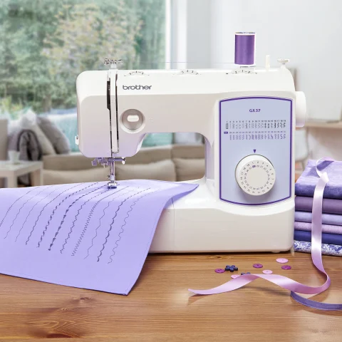 machine on table with fabrics and ribbons