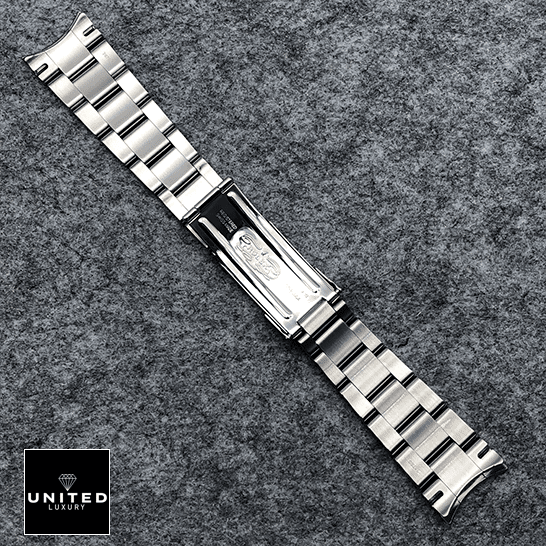 Rolex Perpetual 114300 Replica 3 Rolex Datejust Perpetual 114300 Replica Stainless Steel Fold Clasp Bracelet on the table