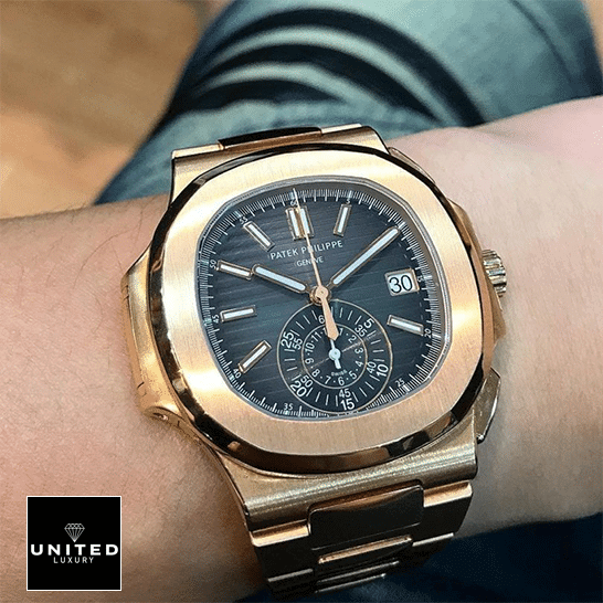 Patek Philippe Nautilus Brown Dial Replica 5 Patek Philippe Black Dial Rose Gold Bezel Replica in the man wrist