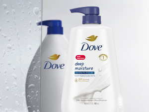 Picture of two different Dove pump bottles with a wet shower glass halfway between them.