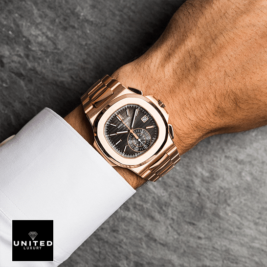 Patek Philippe Nautilus Brown Dial Replica 3 Patek Philippe Nautilus Rose Gold Bezel Black Case Replica on the man wrist