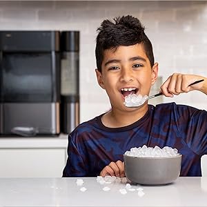 Little boy eating nugget ice
