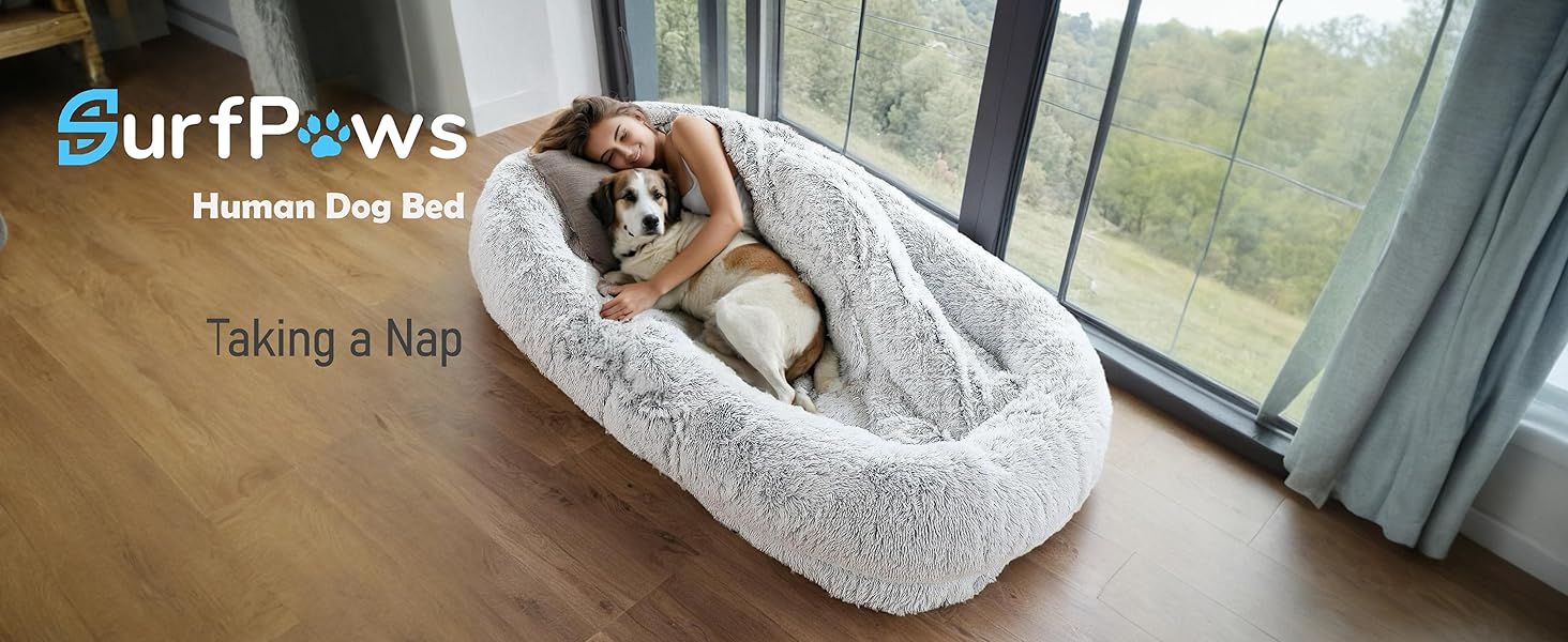 Woman and dog taking a nap on the Surfpaws Human Dog Bed, enjoying the plush comfort
