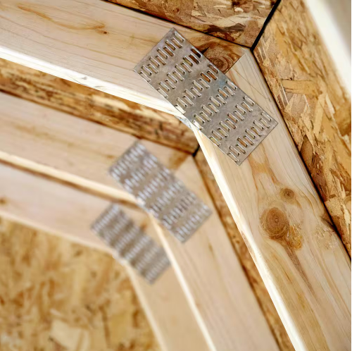 Close-up of corner brackets in the interior of Handy Home Andover 8x12 wood storage shed.