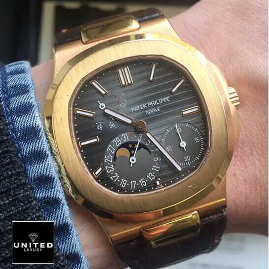 Patek Philippe Nautilus Gold Leather Replica 5 Patek Philippe Nautilus Black Dial Rose Gold Replica on the man wrist