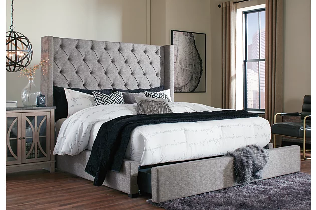 Sleeping beauty. From its button-tufted mansion-wing headboard, to its storage footboard that seamlessly merges form and function, the Sorinella upholstered queen bed with storage is heavenly from head to toe. This high-style favorite includes a generously sized drawer at the foot of the bed that’s perfect for linens, blankets and throws. Woven gray fabric with warm brown undertones is sure to set a soothing mood for your bedroom retreat.Engineered wood frame | Includes headboard, footboard with storage, rails and roll slats | Tufted headboard | Polyester/rayon upholstery | Smooth-gliding storage drawer | Bed does not require a foundation/box spring | Mattress available, sold separately | Small Space Solution | Assembly required | Expert assembly recommended; available at check out for an additional fee | Bed is not compatible with an adjustable base | Estimated Assembly Time: 70 Minutes