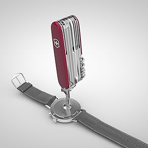 A screwdriver from a pocket knife repairing the back of a watch