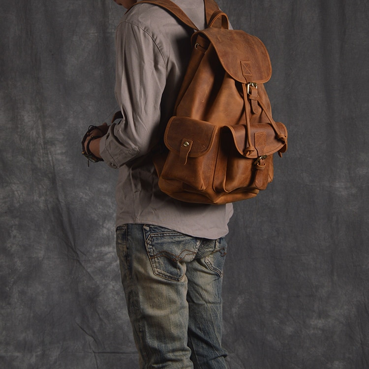 Model Show of Woosir Women Men Genuine Leather Vintage Backpack