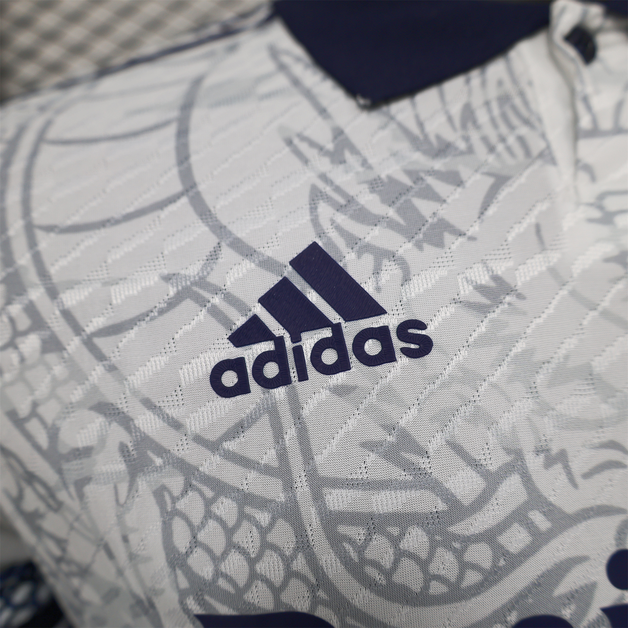 JerseysGala.com | Real Madrid 24-25 Black Dragons Pattern White Special Edition Jersey - Player Version -Customize Name, Number and Patch | Worldwide Shipping