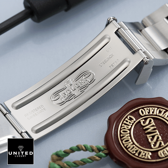 Rolex GMT-Master II Coke 16710 Replica Open Fold Clasp on the table