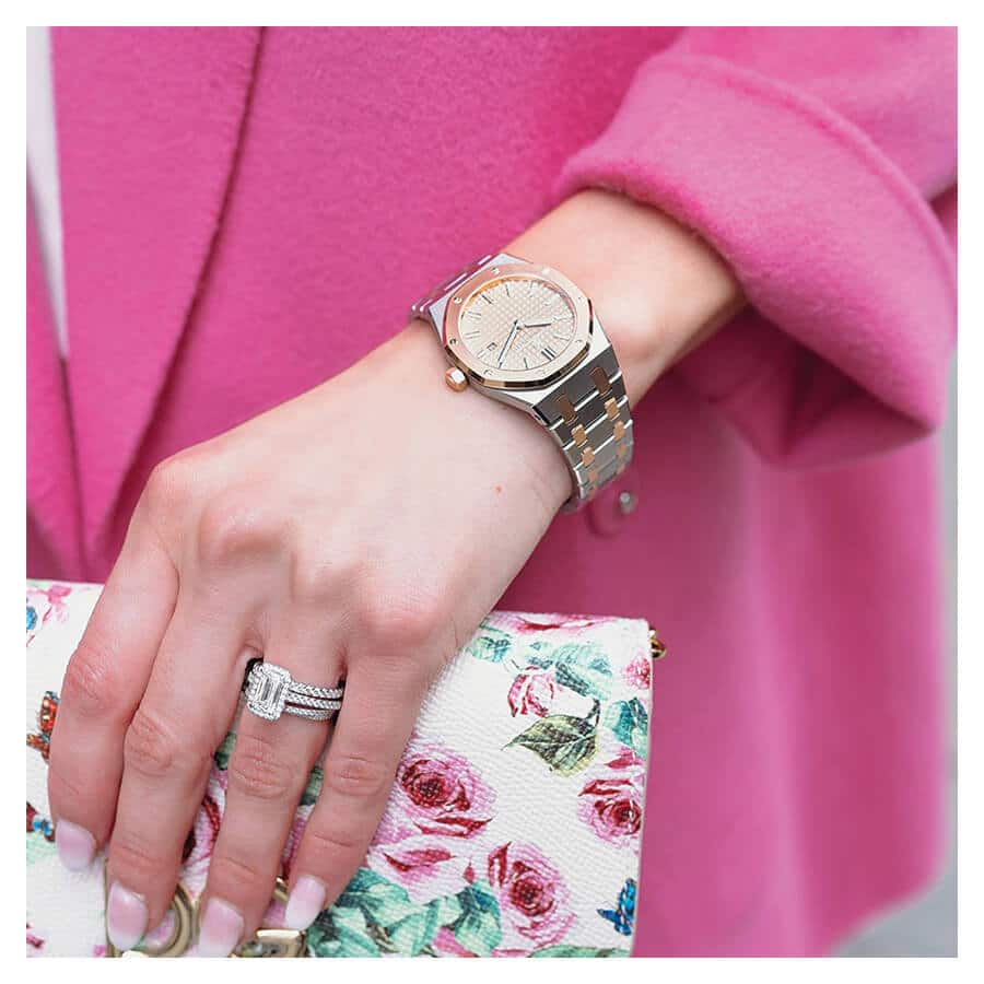 The AP Replica watch on the arm of a woman holding a bag