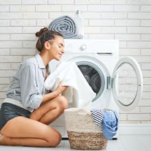 Woman smelling her frangrence free clean clothes