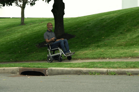 Lightweight eVolt Traveler Power Chair in action, ideal for stable mobility.