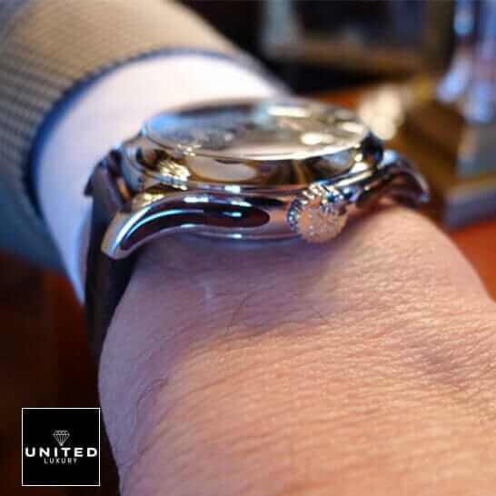 Patek Philippe Geneve Steel Case Replica on the man wrist and crown on the logo