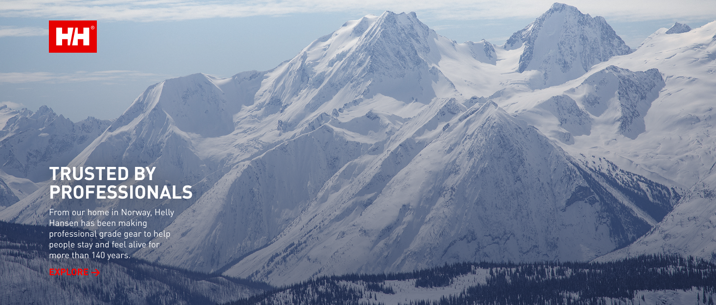 Text reads 'HH TRUSTED BY PROFESSIONALS'. Dramatic landscape photograph of snow-capped mountain peaks against cloudy sky.