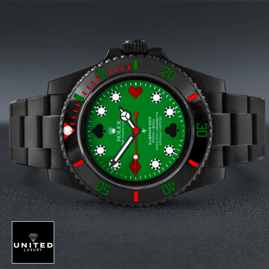 Rolex 114060 Blaken Submariner Poker Green Dial Replica on the table
