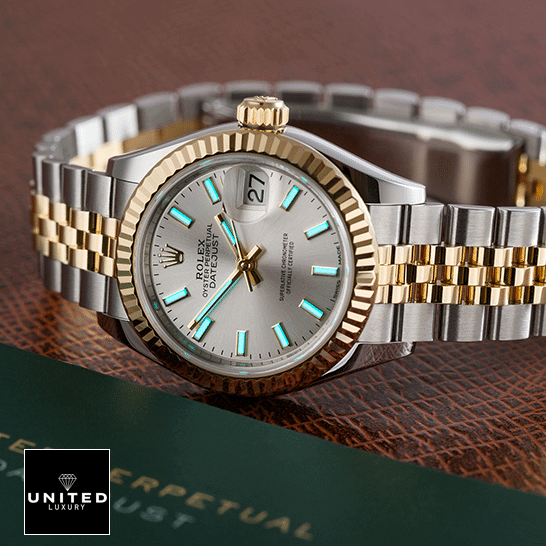 Rolex Datejust 126333 Jubilee Yellow Gold Replica next to warranty card