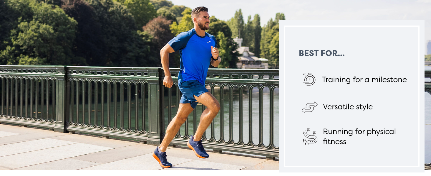 male runner, running on a bridge overlooking a lake