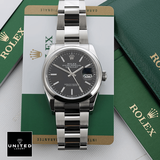 Rolex Datejust 115200-0004 Oyster Perpetual replica 5 Rolex Datejust 115200 Black Dial Replica next to warranty card