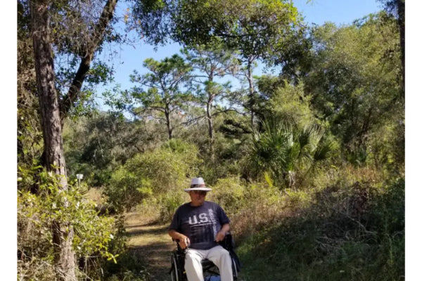 Freedom Trax FT1 Pro Wheelchair Attachment on Grass Trail