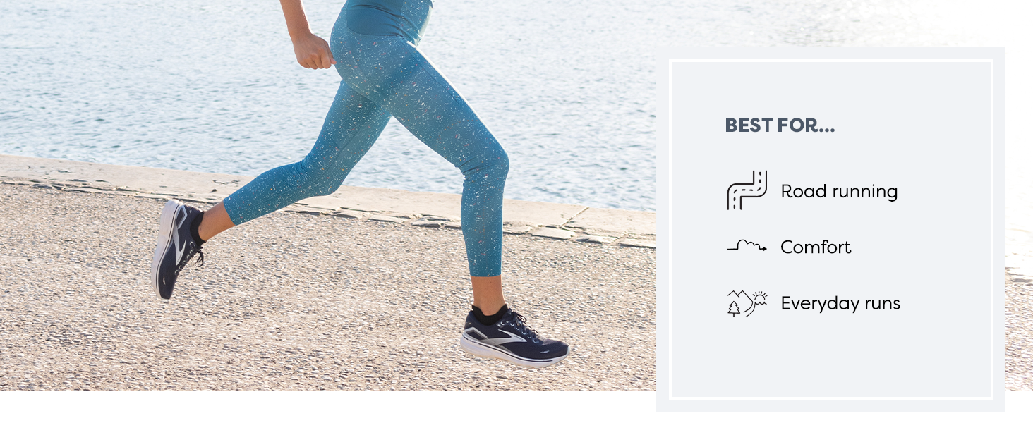 solo female runner, running alongside waterfront