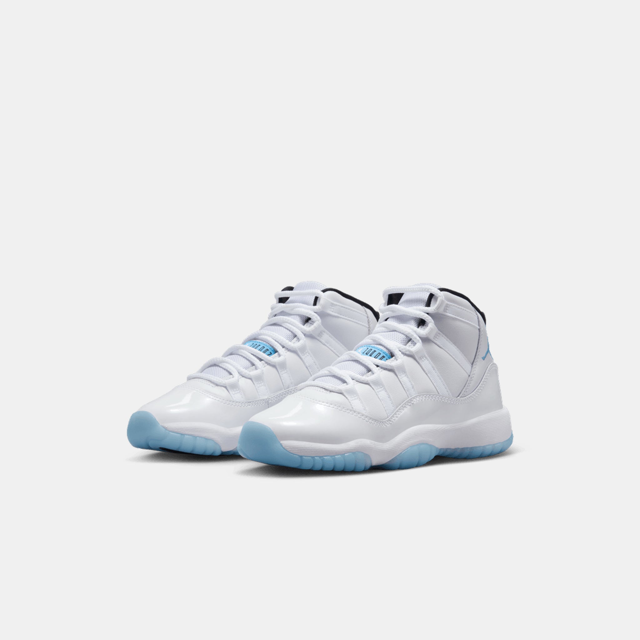 Air Jordan 11 Retro Big Kids Sneaker in White/Legend Blue/Black