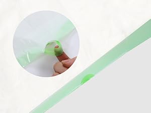 Close-up circular image showing a light green strip or tape being peeled away from a white surface.