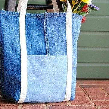 large denim bag on red bricks floor