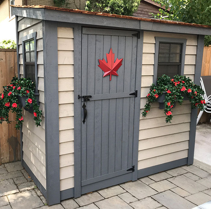 Elegant grey wooden SpaceSaver 8x4 garden shed with a single door, complementing the modern outdoor landscaping