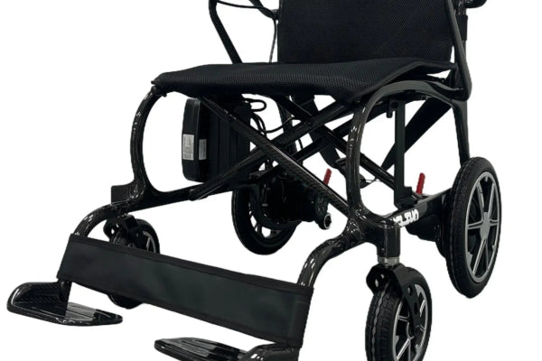 Helium Power Wheelchair folding for compact storage.
