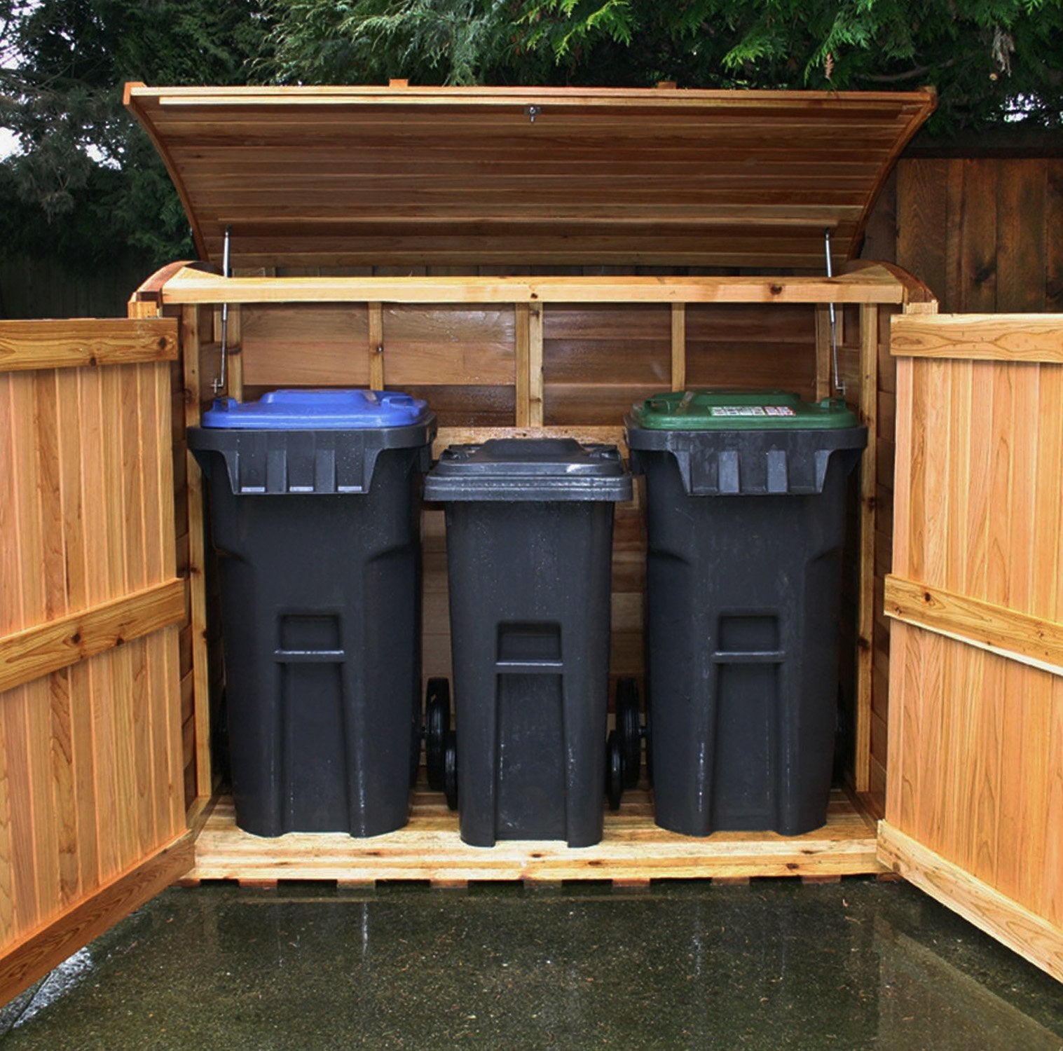 Front view of the Oscar Waste Management Shed 6x3. This wood trash can enclosure has 3 large bins inside, with all doors open to showcase its space.