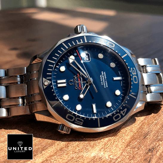 Omega Seamaster 300m Axial Steel Replica on the wooden table