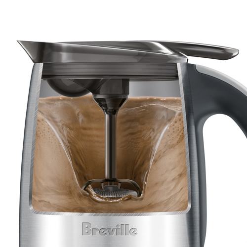 Side view of machine demonstrating how the whisk is mixing the content together.