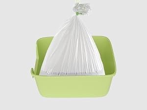 Light green plastic container or tray holding a white garbage bag. The bag is secured around the rim of the container with contents visible inside.