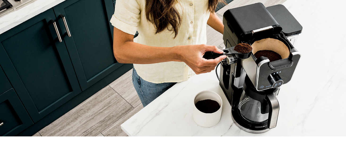 putting coffee grounds in a filter for ninja coffee maker